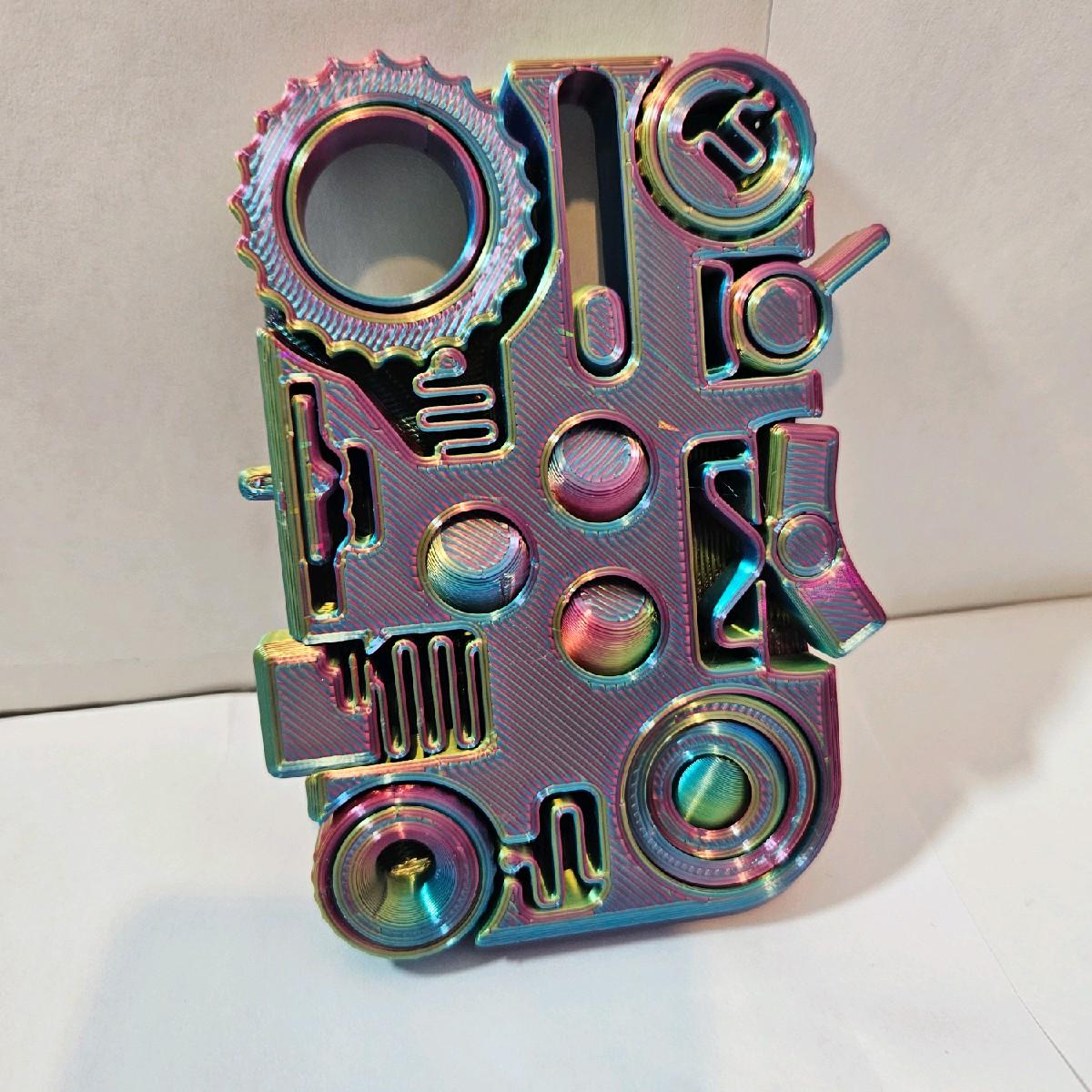 12-in-1 3D Printed Multicolour Fidget Controller, Sensory Toy for ADHD, Autism & Anxiety Relief - 12-in-1 3D printed multicolour fidget controller, packed with spinners, clickers, sliders and dials in one compact sensory toy. Precision printed using premium multicolour filament, perfect for ADHD, autism, anxiety and stress relief, a unique desk toy to keep hands busy and minds focused.